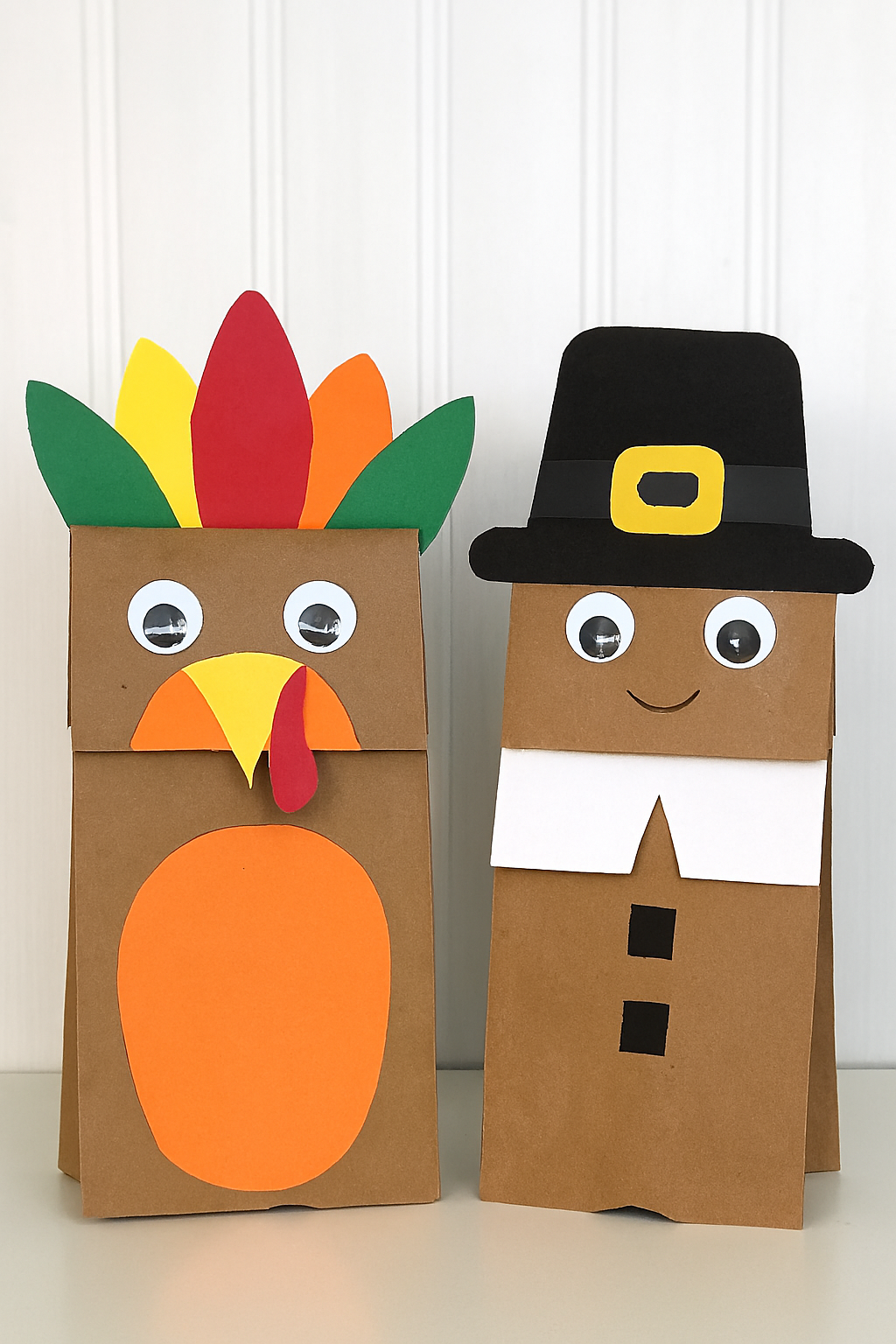 A Turkey and a Pilgrim brown paper bag puppet